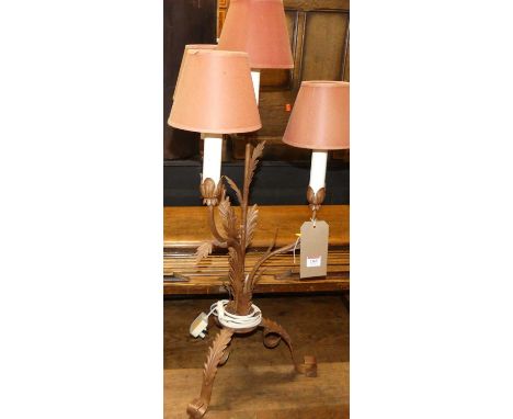 A contemporary pressed metal four branch table lamp