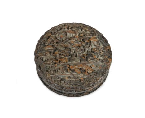 A Chinese tortoiseshell circular snuff box and cover, 19th centuryextensively carved with figures in boats and in a pavillion
