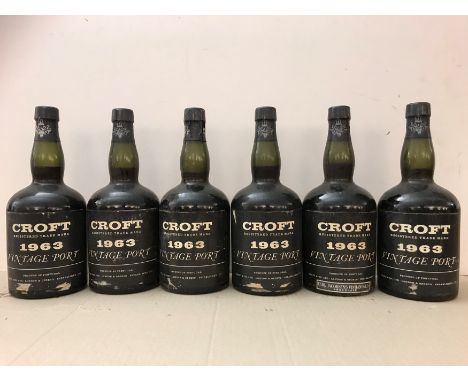 Croft vintage port 1963,12 bottles, Jacobsens Copenhagen slip labelsCondition report: levels: 1 mid shoulder, others base of 