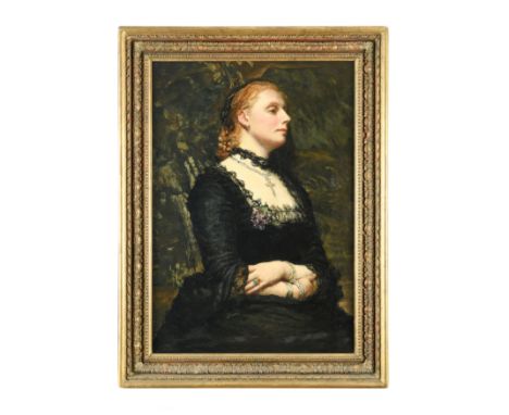 British School, early 20th CenturyPortrait of a lady, half length, wearing a lace trimmed black dress and a pearl set cross p