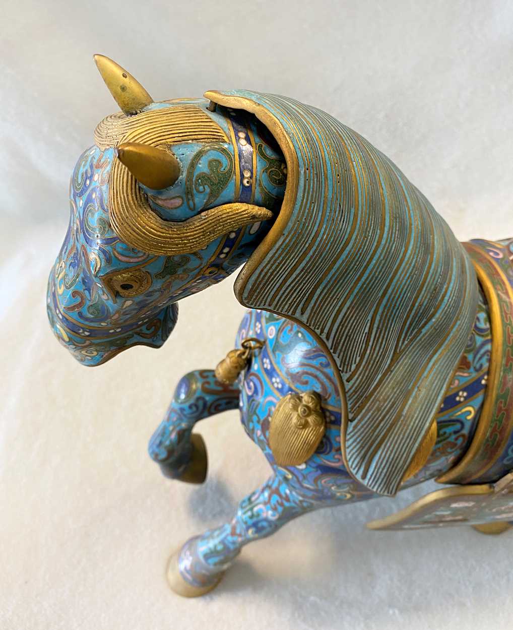 A pair of Chinese cloisonné horses, in Cheffins Fine Art