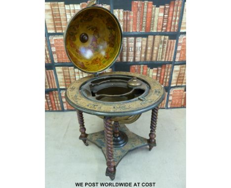 A fitted drinks/tantalus globe with hinged lid (height 98cm)