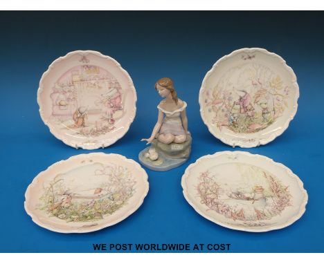 A boxed Lladro figure "Privilege Society 2005" together with four Royal Doulton Wind in the Willows plates