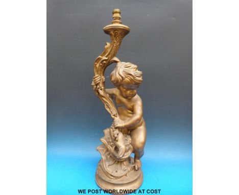 A painted lamp in the form of a putti (height 73cm)  