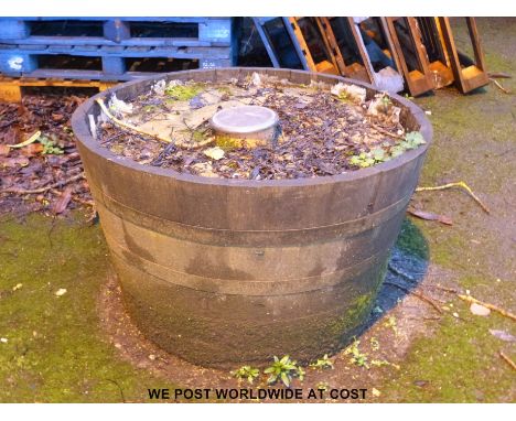 A coopered half barrel planter
