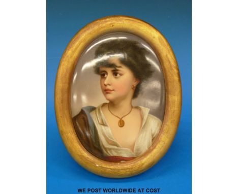 A KPM convex plaque decorated with a head and shoulders portrait of a pretty girl (27cm in length)