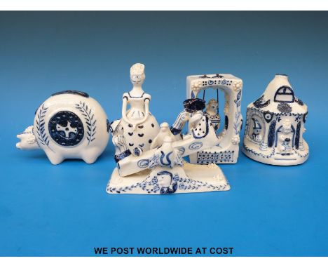 Five Wilfred Gibson blue and white ceramic items, a bell in the form of a lady, a pastille burner, a see-saw, a swing and mon