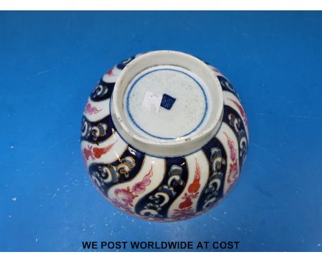 An early Worcester 'Dr Wall' period bowl, painted in underglaze blue and pink in the Queen Charlotte pattern of spiralling fl