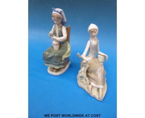 Two Lladro figurines, one of a girl seated and the other of a girl with a dove