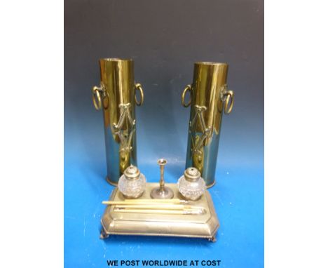 A pair of trench art brass vases, together with a desk set with inkwells and pens