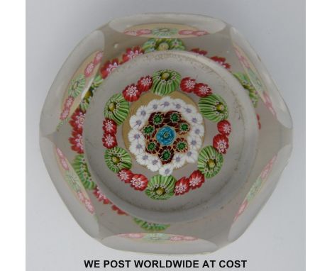 Baccarat faceted millefiori glass paperweight with central blue cane surrounded by a ring of green and red canes, a further r