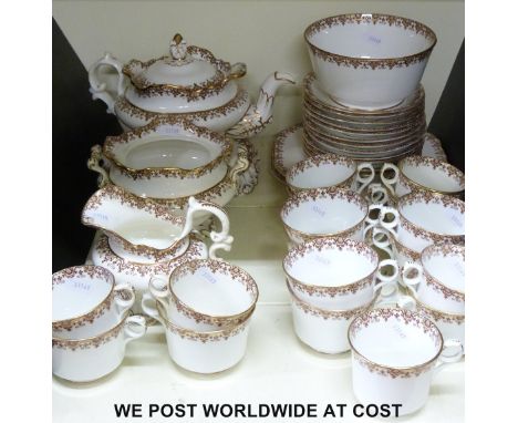 A late Victorian Copeland & Garrett tea set, teapot with stand, milk, sugar basin, sandwich plates, 17 cups and 12 saucers