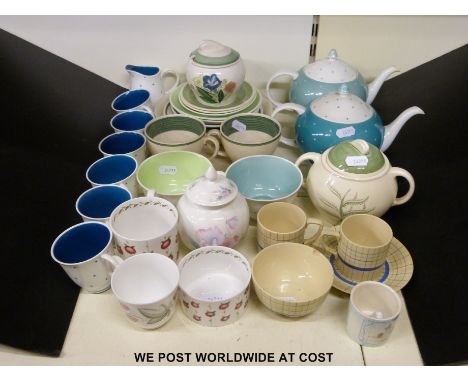 A collection of Susie Cooper to include polka-dot range (two teapots and cups) and a selection of other designs 