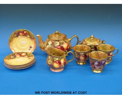 A part painted fruit tea set by ex Royal Worcester artist James Skerrett