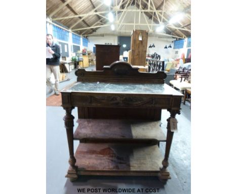 A 19thC carved mahogany marble inset buffet with two undershelves 