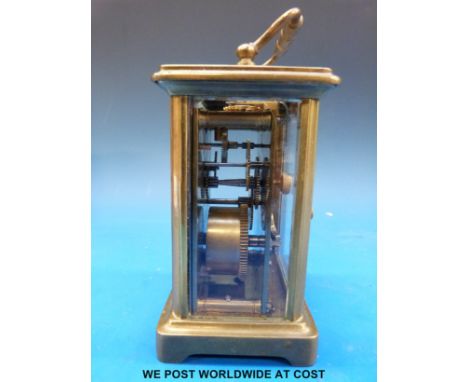 A brass cased carriage clock with keyless movement in outer box