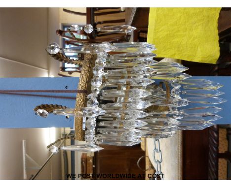 A set of three gilt metal wall mounted light shades with crystal drop lustres 