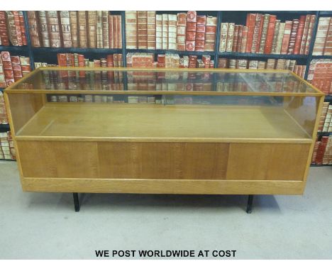 A vintage light oak shop display/haberdashery glazed counter with eight drawers under (length 183cm)
