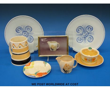 A collection of Susie Cooper to include a jug, a large tankard two plates and a lidded pot