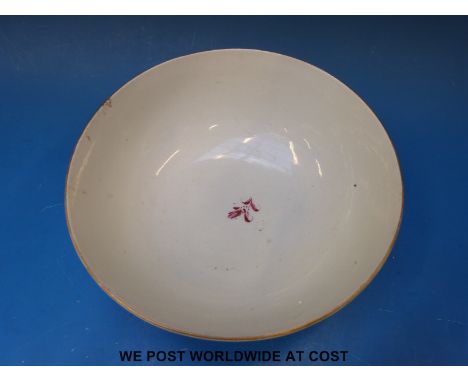 An early Worcester 'Dr Wall' period bowl, painted in puce monochrome with stylized plant sprigs, some enclosed by gold rococo