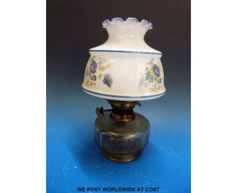 A glass oil lamp with cut glass reservoir 