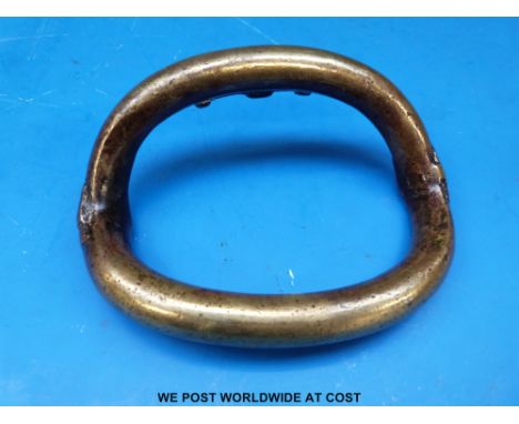 A brass tribal currency bangle