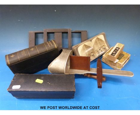 A stereo viewer and over 40 stereoscopic viewing cards, together with a set of Puss in Boots coloured lantern slides, 'Indcol