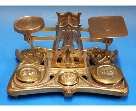 A set of possibly Setton & Durward brass Art Nouveau / Arts and Crafts postage scales the brass base and A frames with Archib