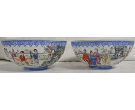 A pair of Chinese eggshell porcelain bowls, enamelled in the famille rose palette with courtiers in garden between blue patte