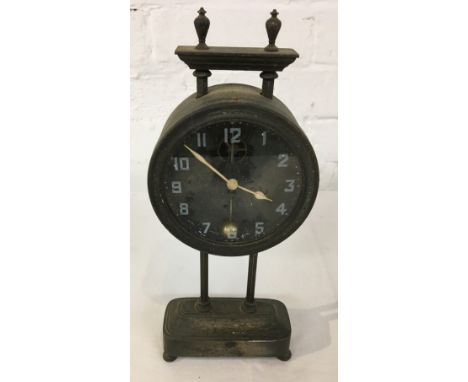 An unusual gravity driven mantle clock, the silver plated frame raised on four bun feet, drum movement with Arabic chapter et