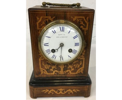 19th century striking mantle clock, rosewood veneer case with foliate and geometric boxwood inlay and stringing, white enamel