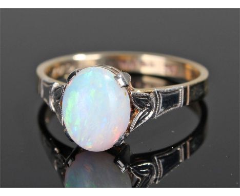 9 carat gold opal set ring, with a central opal