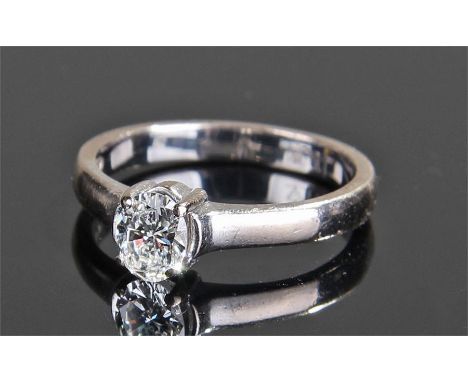 18 carat white gold diamond ring, the central approximately 0.46 carat diamond within an oval claw setting, ring size L