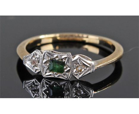 9 carat gold diamond and emerald ring. the central emerald flanked by diamonds, ring size L