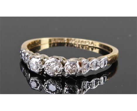 18 carat gold and diamond set ring, with a row of three diamonds, ring size H