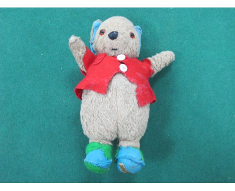 A Circa 1950's Merrythought Mr Woppit Teddy Bear, light brown with orange glass eyes, black stitched nose and mouth, pointed 