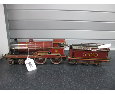 A Bassett Lowke 'O' Gauge/7mm Clockwork 4-4-0 Steam Locomotive, with six wheel tender, L.M.S maroon "George The Fifth", R/No.