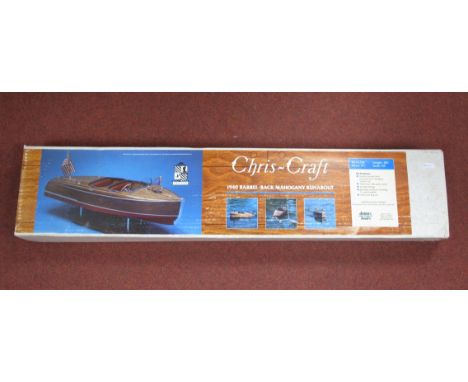 A Dumas Boats Wooden Kit #1234 Model of a Chris Craft 1940 Barrel - Black Mahogany Runabout, length 28½", beam 9¾, scale 1:8t