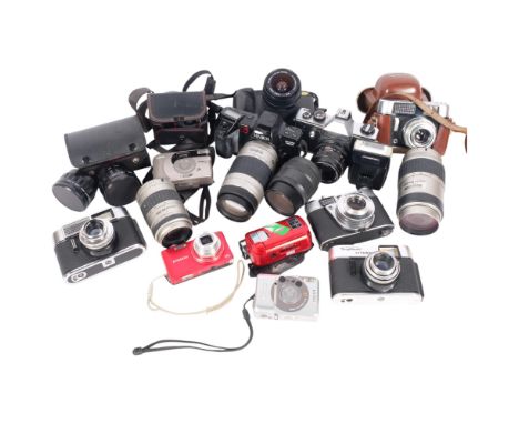 A box of various cameras and lenses, including a Praktica MTL3, a Canon IXUSL-1, a Pentax FA 1:4.7-5.6 80-200mm lens, etc (bo