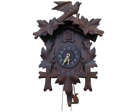 A late 19th century Black Forest carved wood cuckoo clock, with weights, H45cm