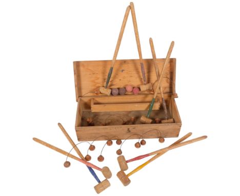 A miniature croquet set in fitted pine carry case, from JAQUES. Case 42x10x17cm.