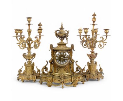 A French Napoleon III gilt cast-brass 3-piece clock garniture, in Louis XVI style, comprising 8-day clock and pair of 5-light
