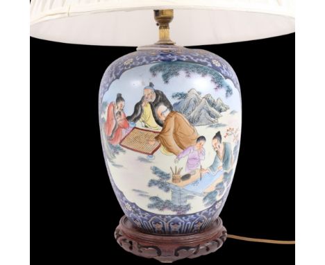 A Chinese painted porcelain jar table lamp, depicting figures studying a scroll painting and playing games, overall height 59