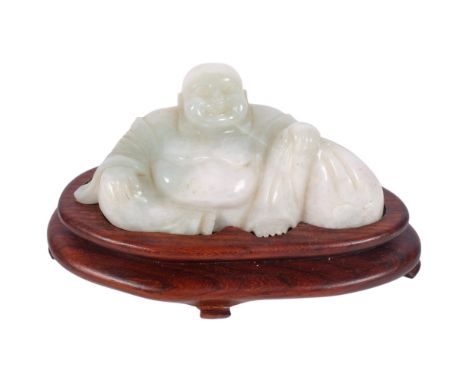 A Chinese carved and polished jade seated Buddha figure, 11.5cm, on fitted hardwood base