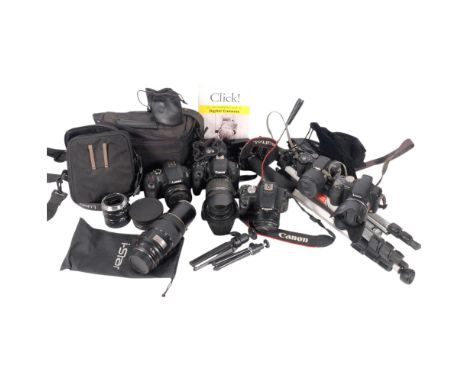 A collection of various cameras and equipment, including a Lumix 60X optical zoom, a Canon ES800D with a EF-S 18-200mm zoom l