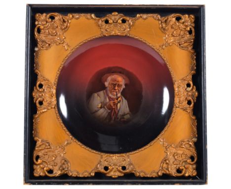 A Continental pottery portrait plaque, in ornate gilt frame set in wooden mount, 45cm x 45cm