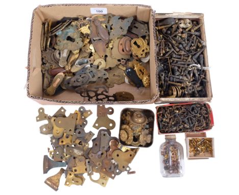 A quantity of furniture mounts, including brass escutcheons, ring handles, shelf supports, etc
