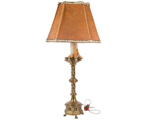 An impressive Victorian heavy Gothic brass lamp with foliate design, on lion paw feet with shade, H98cm overall