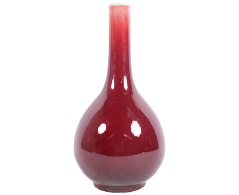 A Chinese copper red glazed sang de boeuf bottle vase, 34cmBase has several hairline cracks and small chips around bottom rim