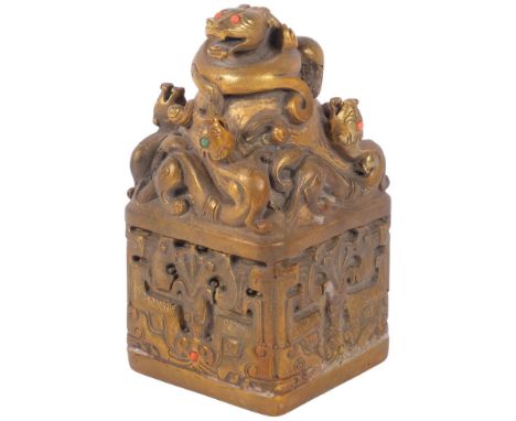 Ornate Chinese gilt-bronze seal with stone set decoration, H17cm